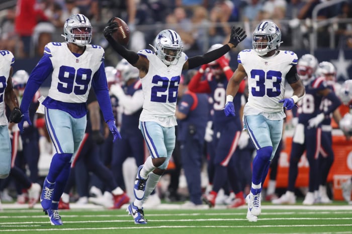 Dallas Cowboys cornerback DaRon Bland (26) celebrates an interception with his teammates in the fourth quarter against the New England Patriots at AT&T Stadium.